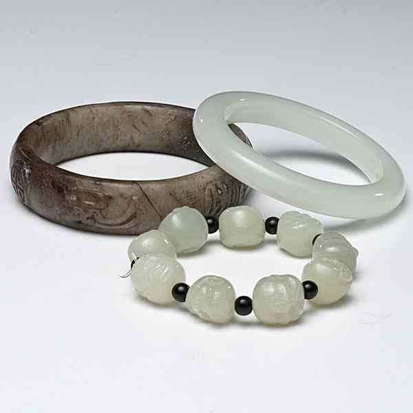 Appraisal: Jade Bracelets Chinese includes two jade bracelets the first a