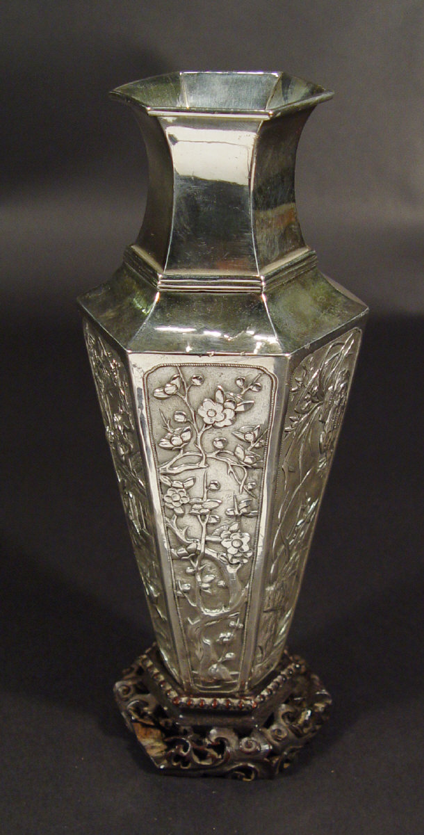 Appraisal: Chinese hexangonal silver vase embossed with panels of figures and