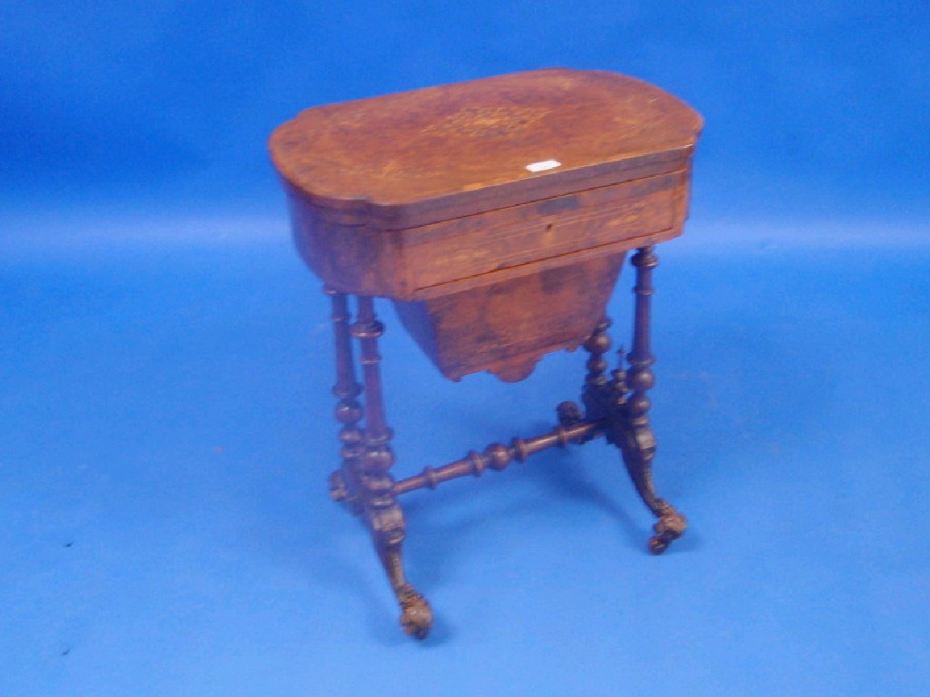 Appraisal: A Victorian burr walnut work and games table with shapes