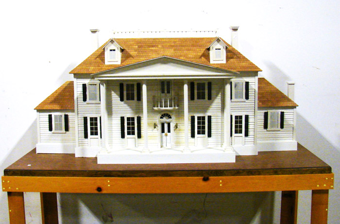 Appraisal: Colonial style doll house on table base Three story electrified