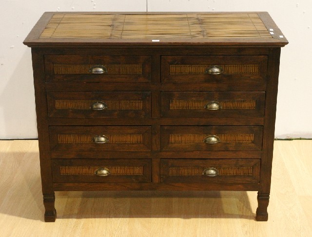 Appraisal: A stained pine chest of drawers with eight drawers