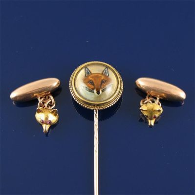 Appraisal: A gold stick pin moulded with a reverse carved crystal