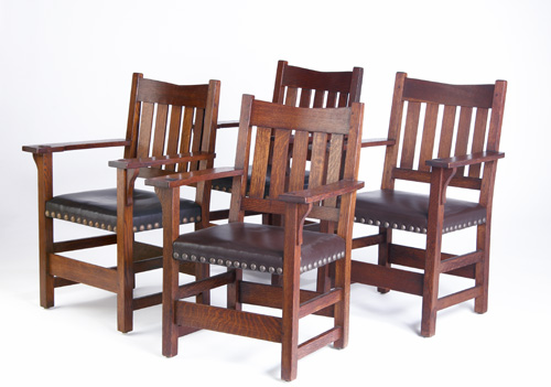 Appraisal: GUSTAV STICKLEY Set of four V-back armchairs with five vertical