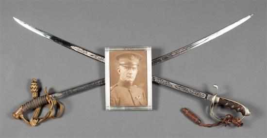 Appraisal: Two United States officer's swords together with silver-framed photo of