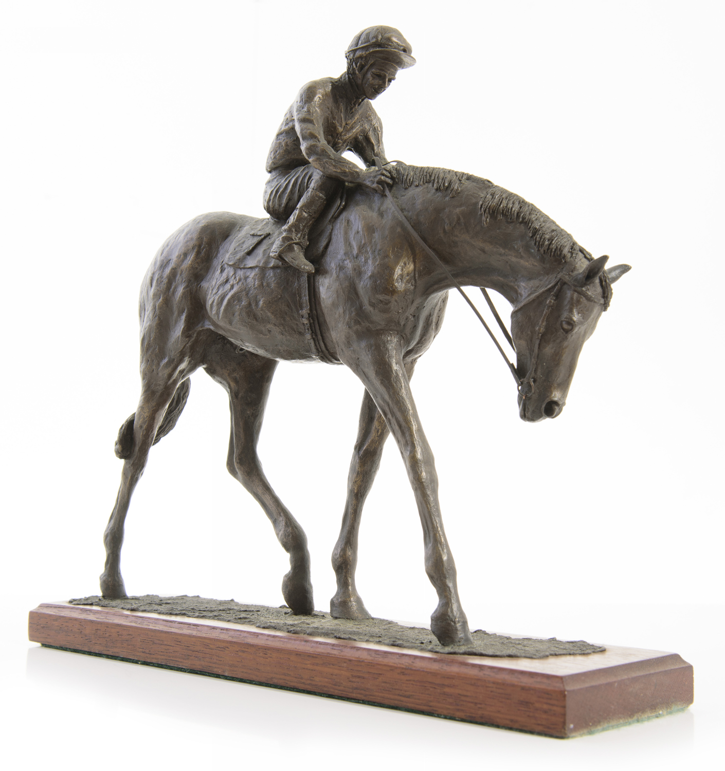 Appraisal: A BRONZED RESIN FIGURE OF JOCKEY AND HORSE SIGNED AND