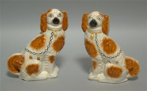 Appraisal: PAIR OF STAFFORSHIRE FIREBACK SPANIELS The red and white spotted