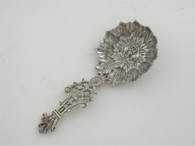 Appraisal: A late Victorian caddy spoon with an openwork 'lyre'-shaped handle