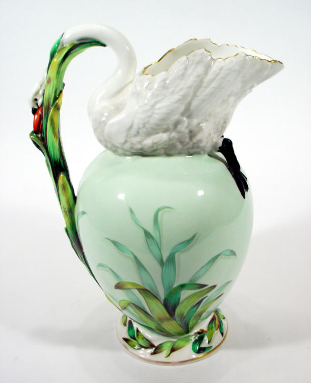 Appraisal: Mintons style ewer with swan neck and reed handle hand