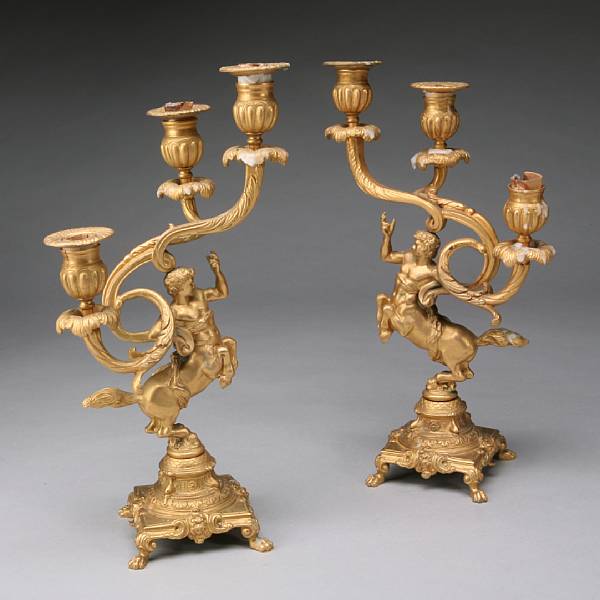 Appraisal: A pair of gilt bronze three light candelabra th century