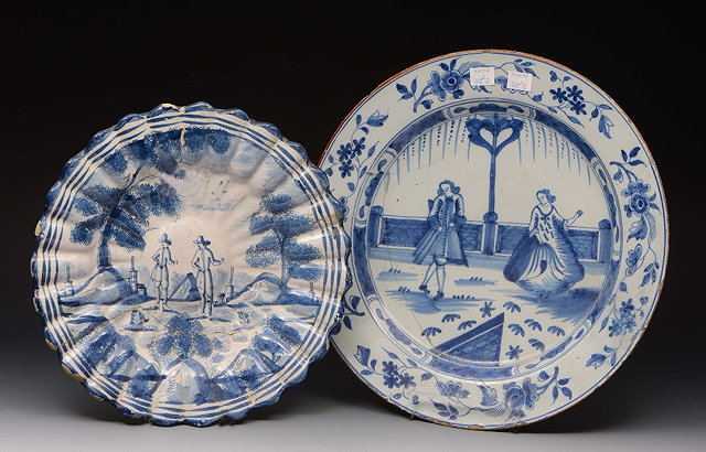 Appraisal: A DUTCH DELFT FLUTED DISH with blue and white sponged