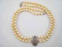 Appraisal: A two row cultured pearl necklace with a white metal