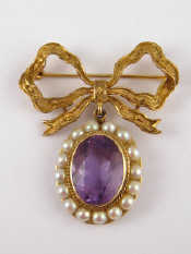 Appraisal: A carat gold bar brooch with associated amethyst pendant marked