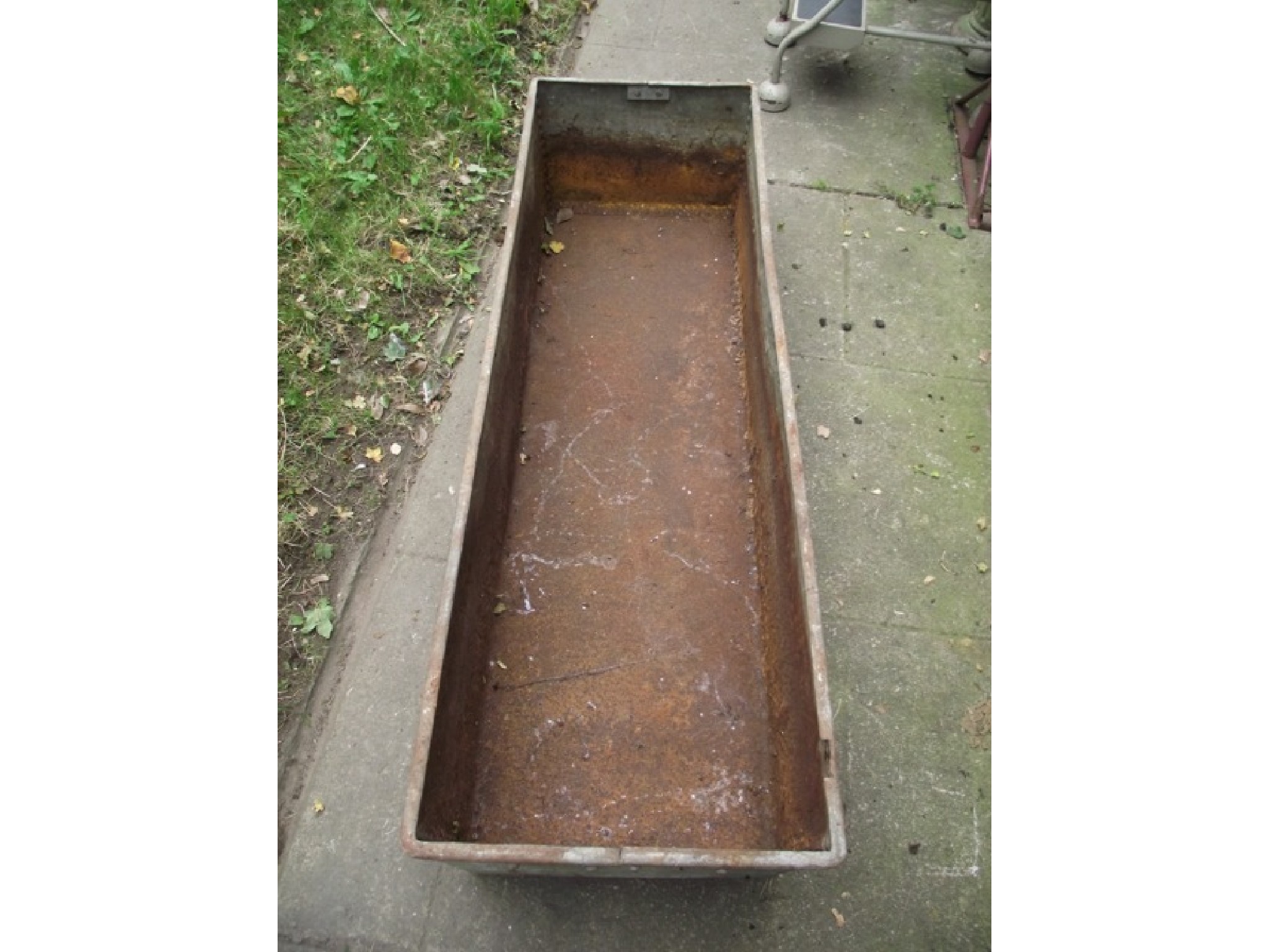 Appraisal: A vintage galvanised steel trough of rectangular form with folded