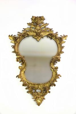 Appraisal: A Florentine gilt framed wall mirror of cartouche shape cm