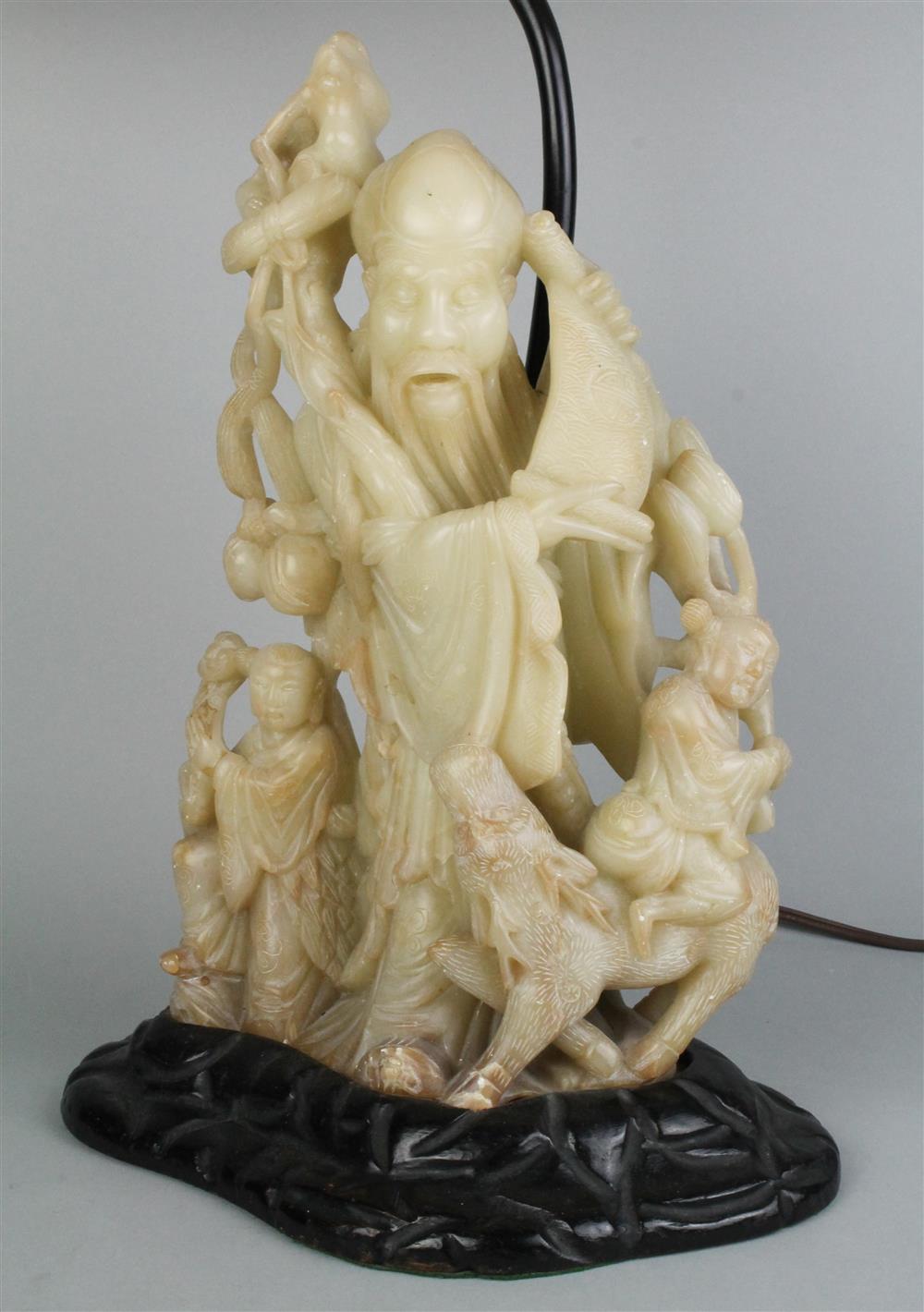 Appraisal: CHINESE CARVED SOAPSTONE FIGURE OF SHOULAO WITH SCROLL AND DEER