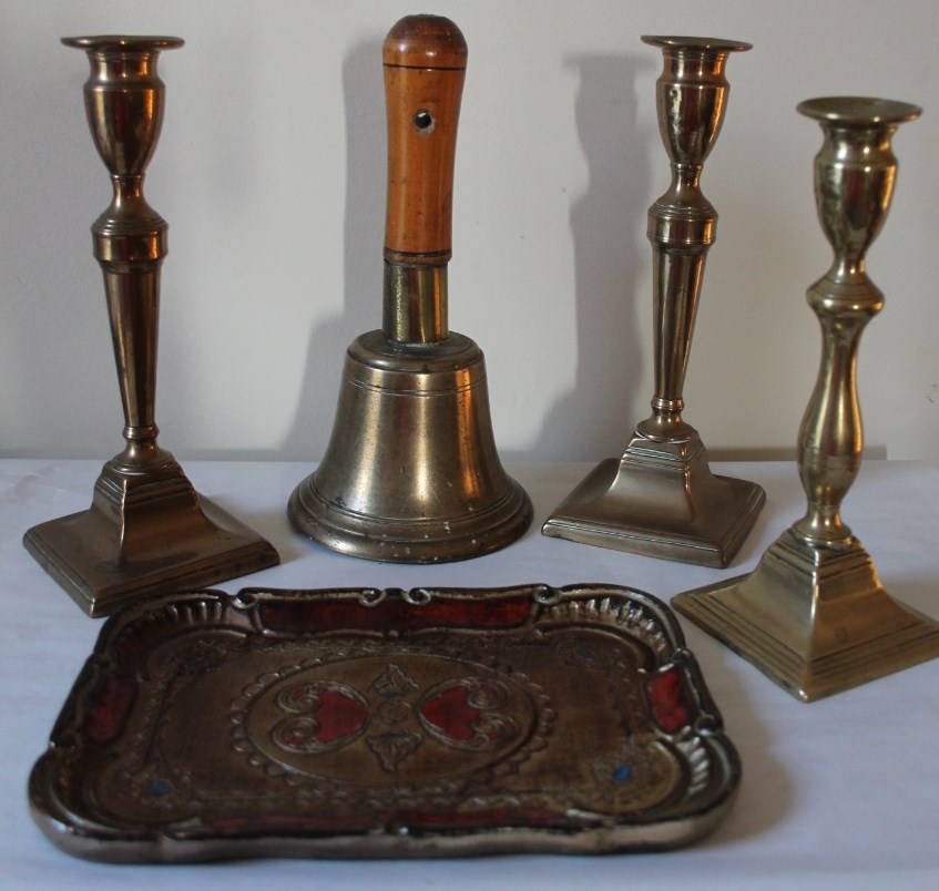 Appraisal: A brass handbell three Victorian brass candlesticks and small tray