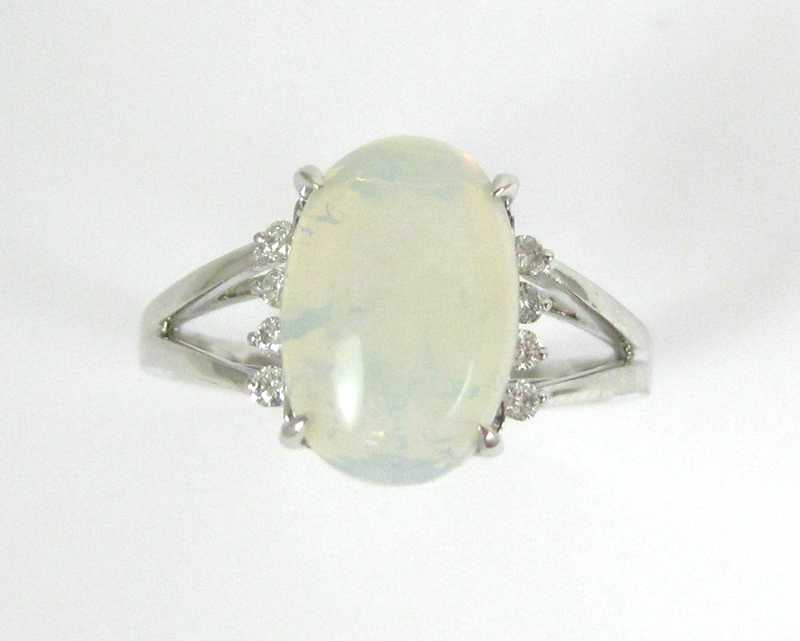 Appraisal: OPAL DIAMOND AND FOURTEEN KARAT GOLD RING The white gold