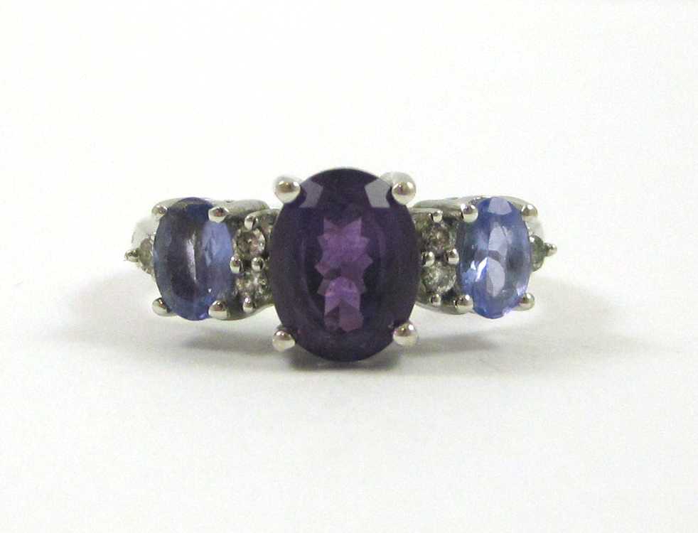 Appraisal: AMETHYST TANZANITE AND DIAMOND RING The k white gold ring