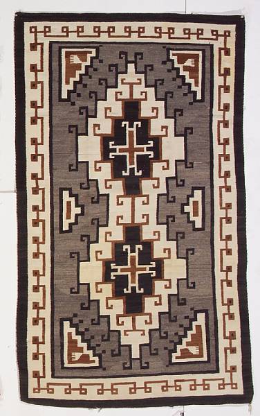 Appraisal: A Navajo Two Grey Hills rug Aligning a pair of