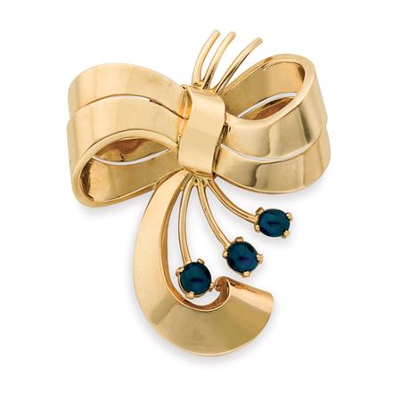 Appraisal: Gold and Cabochon Sapphire Bow Clip-Brooch Estimate -