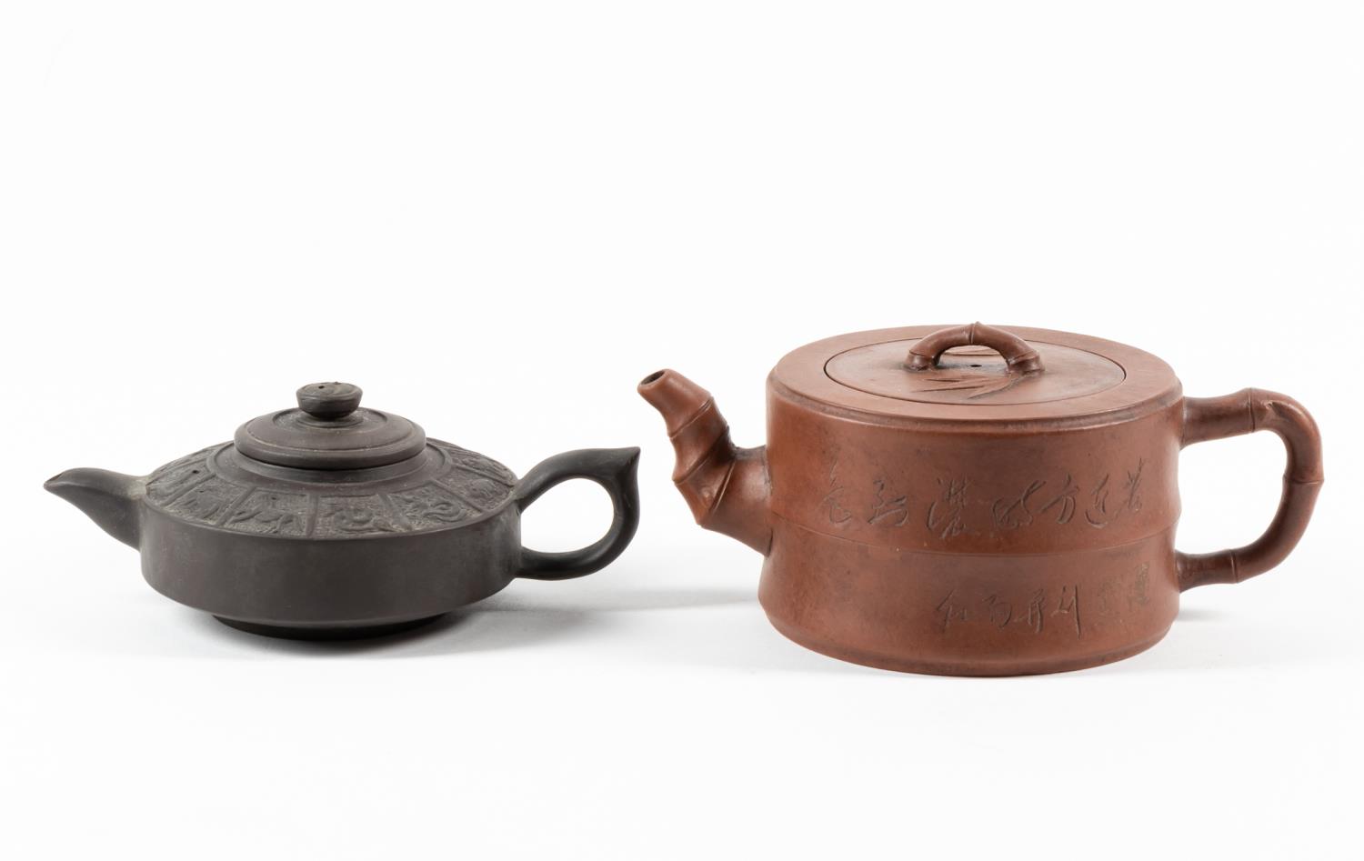 Appraisal: TWO CHINESE YIXING CLAY TEAPOTS Two Chinese clay teapots comprising