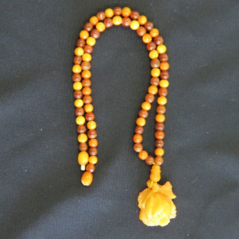 Appraisal: Amber Necklace alternating dark and light amber beads with a