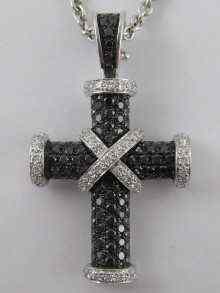 Appraisal: An carat white gold cross pave set with black and