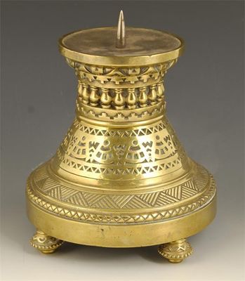 Appraisal: A brass pricket candlestick raised on four bead edge circular