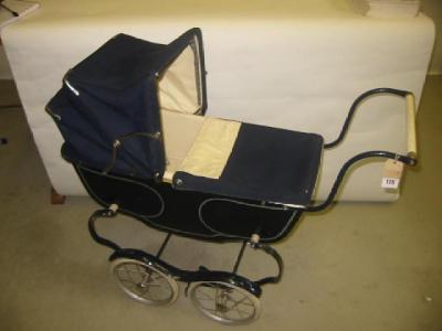 Appraisal: A Denette coach built doll's pram with blue canvas hood