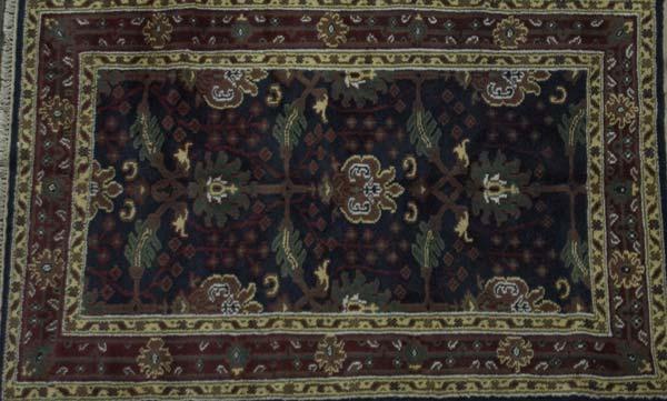 Appraisal: WILLIAM MORRIS STYLE Area rug with floral pattern on midnight