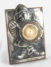 Appraisal: A novelty silver mounted barometer designed as a policeman hallmarked