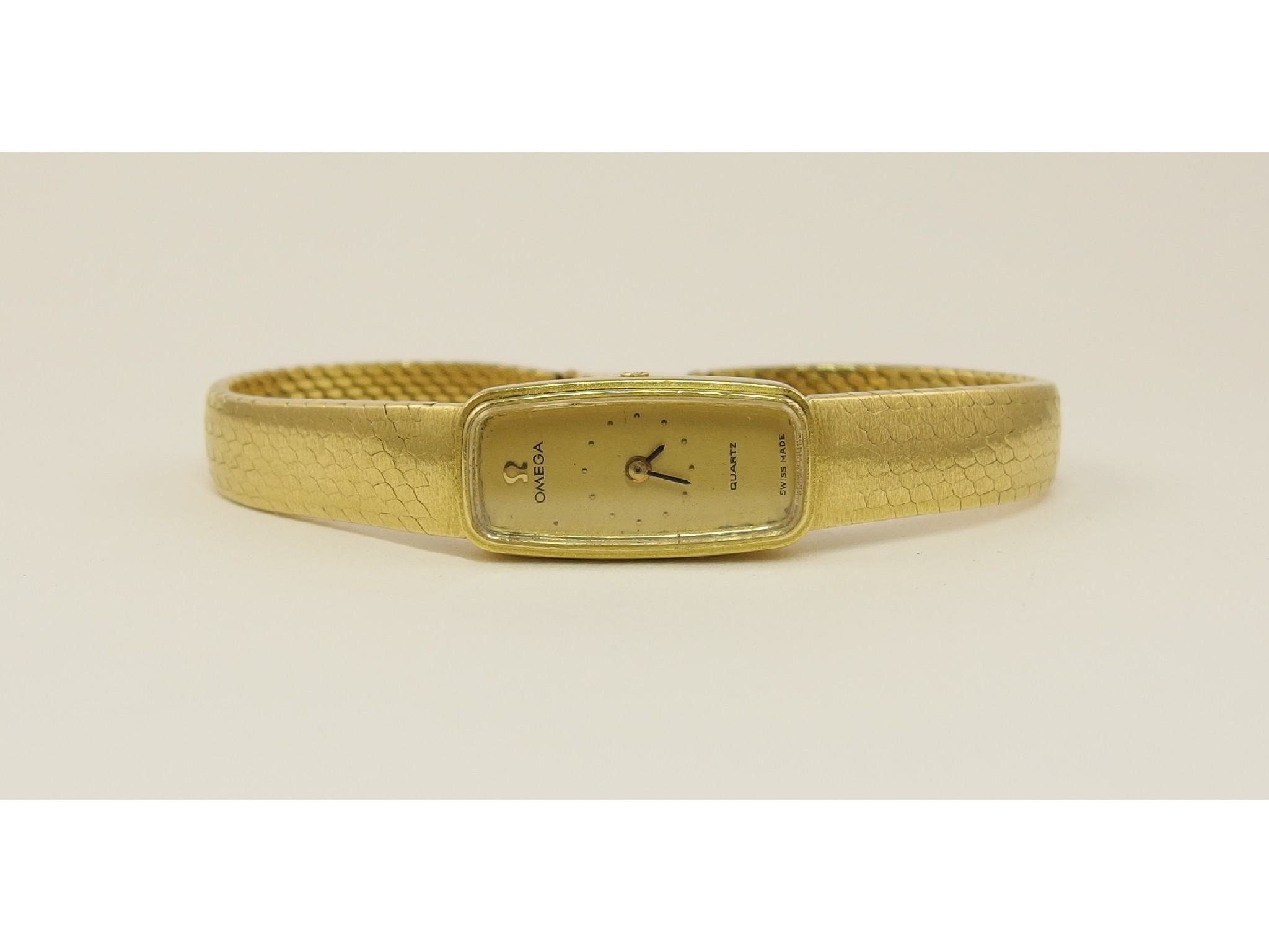 Appraisal: An ct ladies Omegawith matt textured integral strap with gold