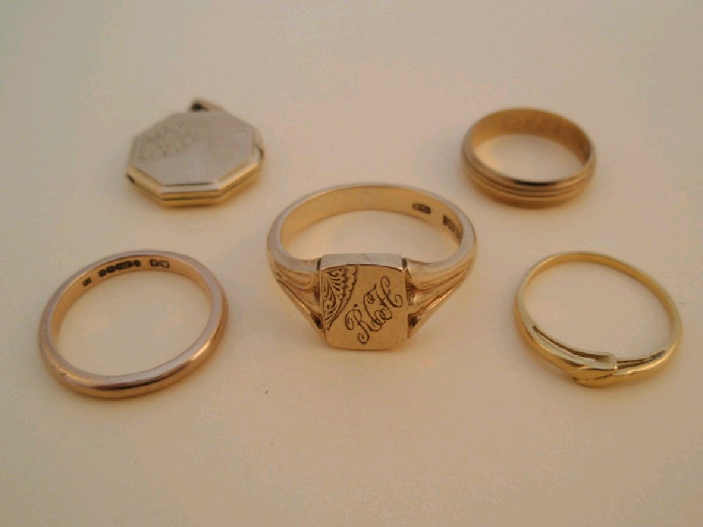 Appraisal: Four gold rings and one locket various grades