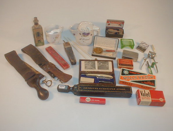 Appraisal: A collection of razors strops and other shaving related items