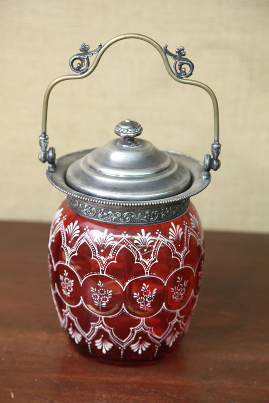 Appraisal: BISCUIT JAR Cranberry glass having white geometric and floral enameled