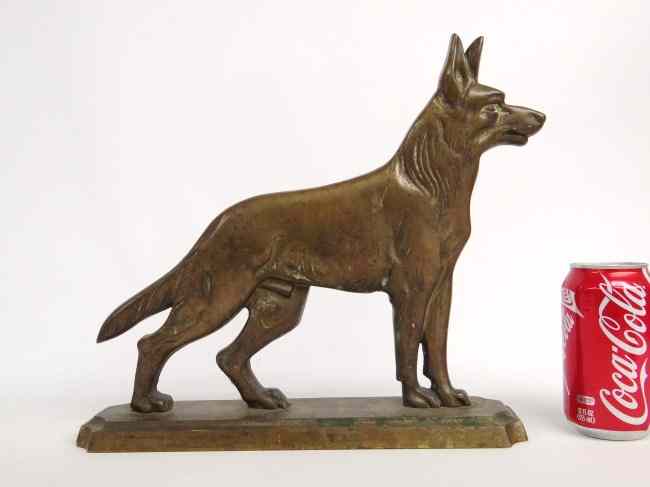 Appraisal: Brass dog doorstop early th c stamped ''Miller Brass Foundry