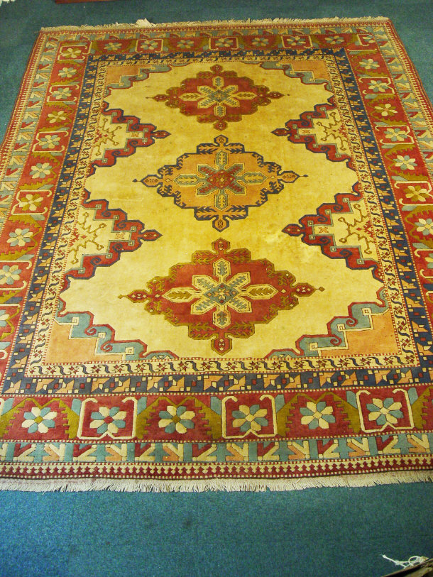 Appraisal: Large rectangular carpet stitched in colours with flowers onto a