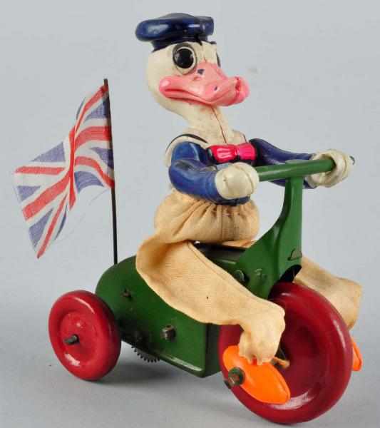 Appraisal: Celluloid Disney Donald Duck Tricycle Wind-Up Toy Description Japanese Circa