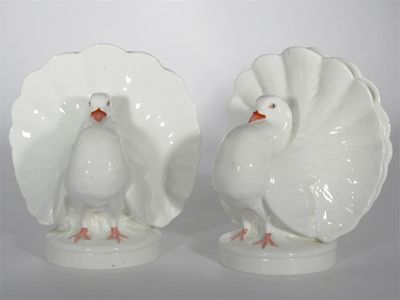 Appraisal: A pair of Mintons fan-tailed dove vases naturalistically coloured impressed