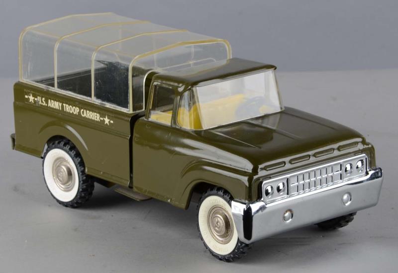 Appraisal: Structo Pressed Steel U S Army Truck This green troop