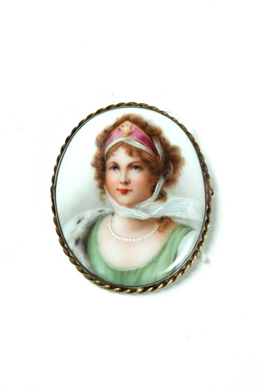 Appraisal: PORCELAIN BROOCH Late th-early th century portrait of young lady