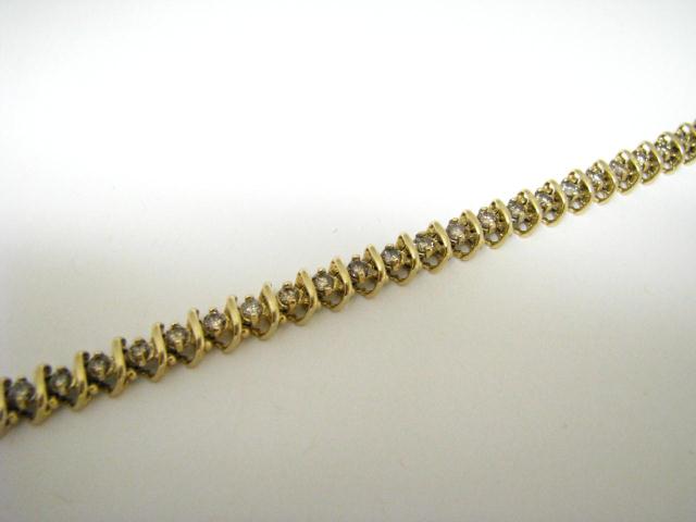 Appraisal: K yellow gold line bracelet containing round brilliant cut diamonds