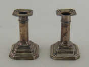 Appraisal: A pair of short candlesticks on square bases with cut