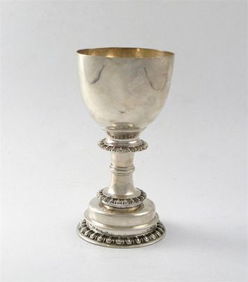 Appraisal: A metalware goblet on a stepped pedestal foot with tongue