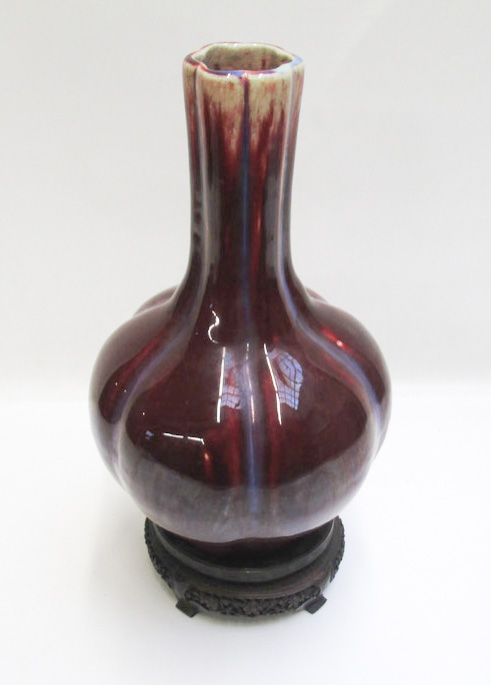 Appraisal: CHINESE EARTHENWARE FLAMBE VASE with ribbed bulbous body and cinched