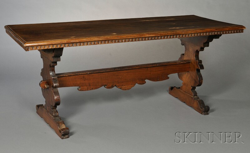 Appraisal: Italian Trestle Table th century tabletop with chip-carved frieze shaped