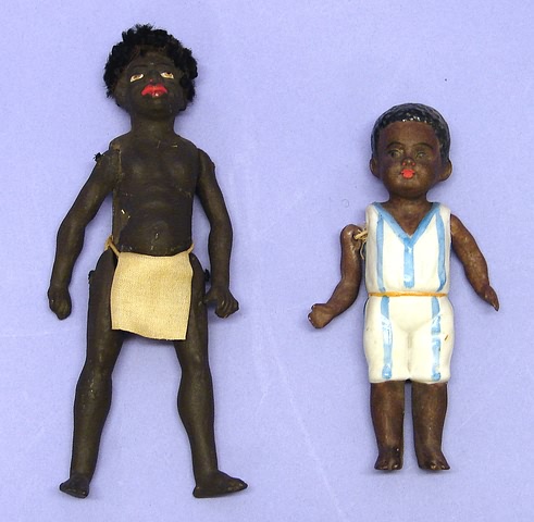 Appraisal: Pair of dolls papier mache black male doll wearing a