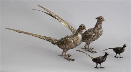 Appraisal: TWO GRADUATED PAIRS OF GERMAN SILVER PHEASANT TABLE DECORATIONS The