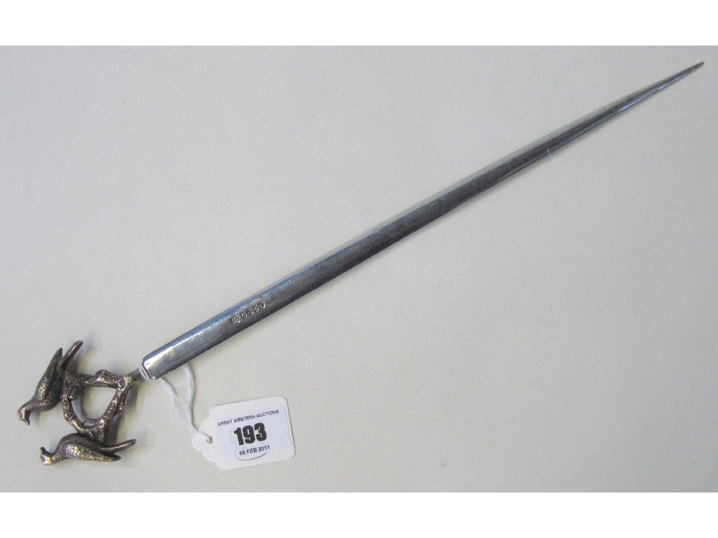 Appraisal: White metal letter opener with bird decorated finial