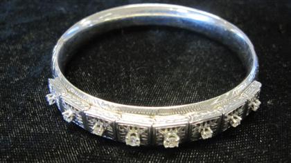 Appraisal: karat white gold and diamond bangleApplied bracelet links displaying eight